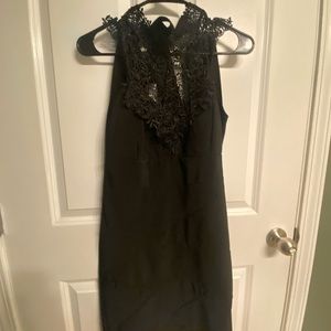 High neck lace top mini dress with tie back closure